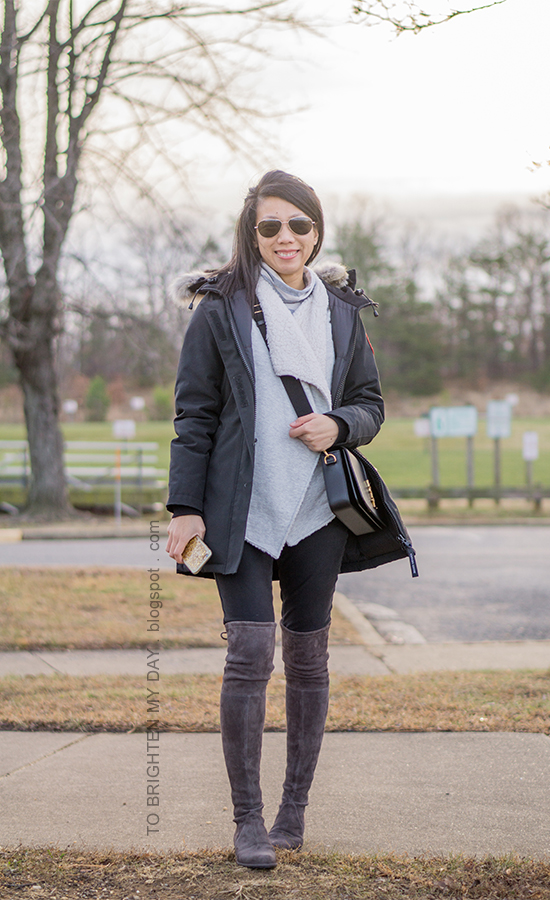 black parka, gray striped turtleneck, gray sherpa lined open cardigan, black crossbody bag, gray over the knee suede boots