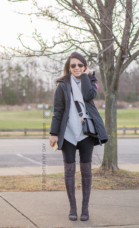 black parka, gray striped turtleneck, gray sherpa lined open cardigan, black crossbody bag, gray over the knee suede boots