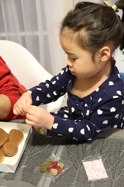 Mio examining the parts of the gingerbread turkey