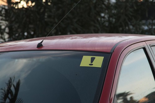 Exclamation sticker on the windscreen of a Russian car