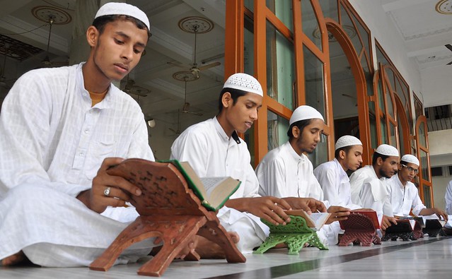 Young Muslim boys recite text from Holy Quran at a Madrassa in Guwahati in Assam.