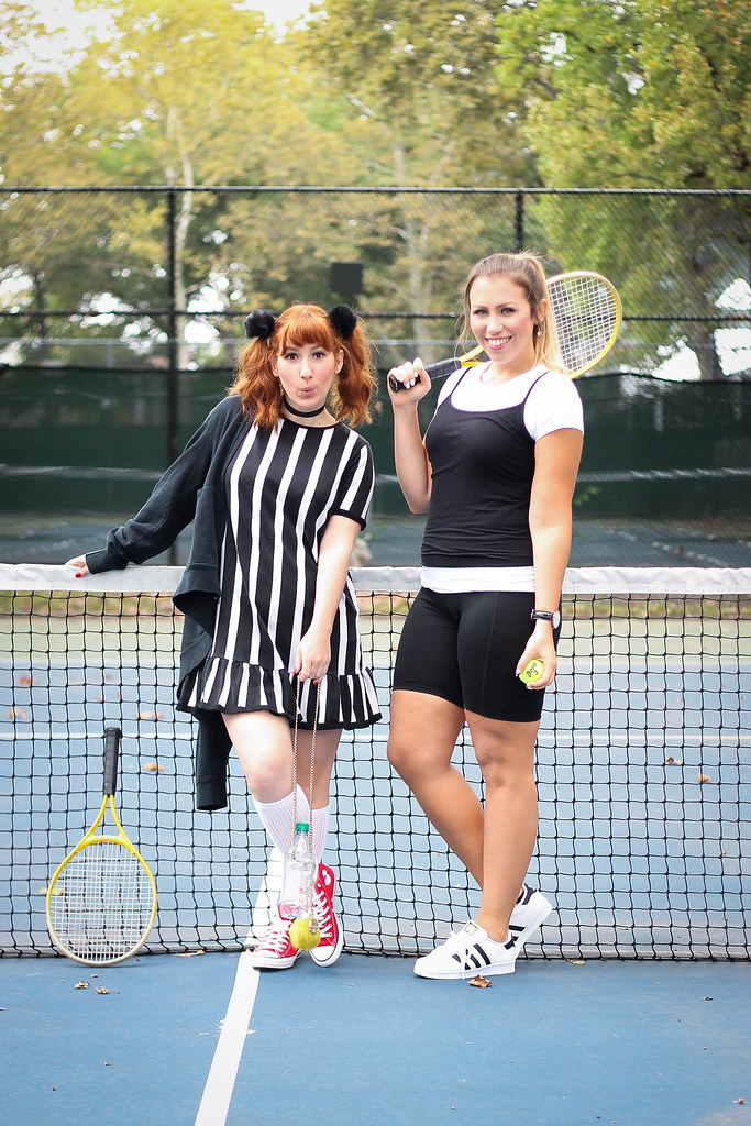 two women wearing their Cher & Amber Clueless Movie Tennis 90s Halloween Costumes