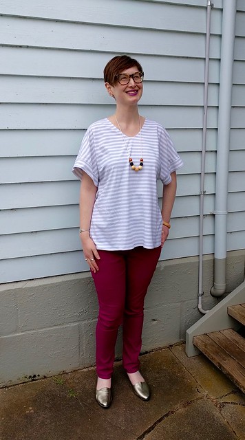 A woman wears Style Arc Elle Pant in berry and Named Sointu Tee in stripes