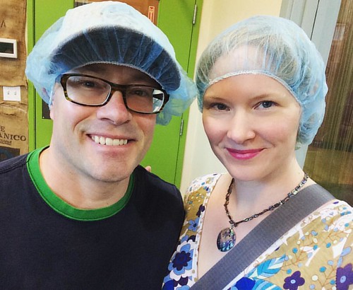 A couple of dorks touring a chocolate factory for funsies.