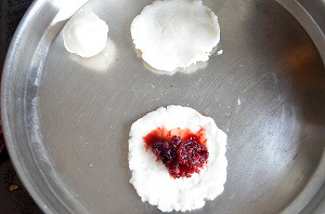 How to make kolukattai - Sweet beetroot modak - flatten dough and place stuffing