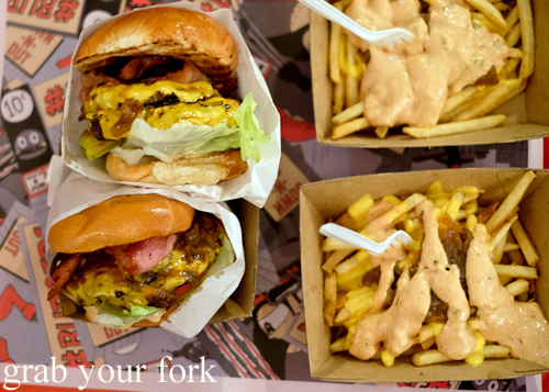 Double cheeseburgers Tiger-style with bacon and Tiger fries from Down-N-Out at the Sir John Young Hotel, Sydney