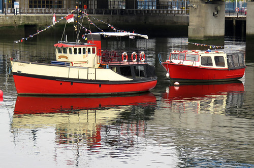 Red boats in the Belfast harbour, Ireland