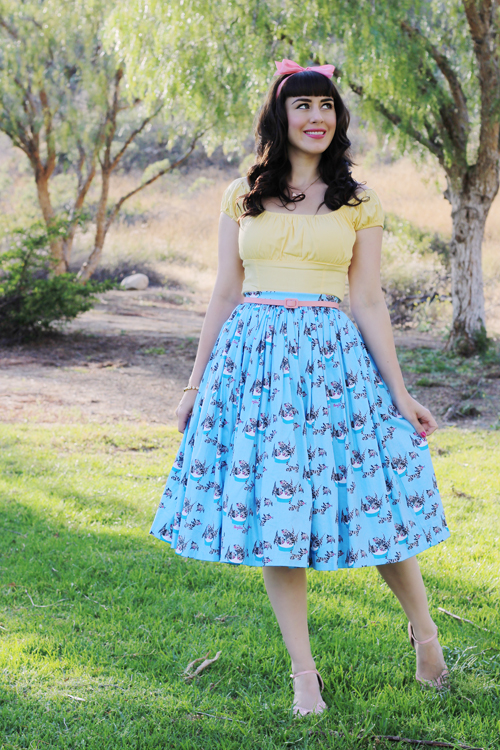 Pinup Girl Clothing Pinup Couture Jenny Skirt in Mary Blair Grey Cat Print Peasant Top in Yellow