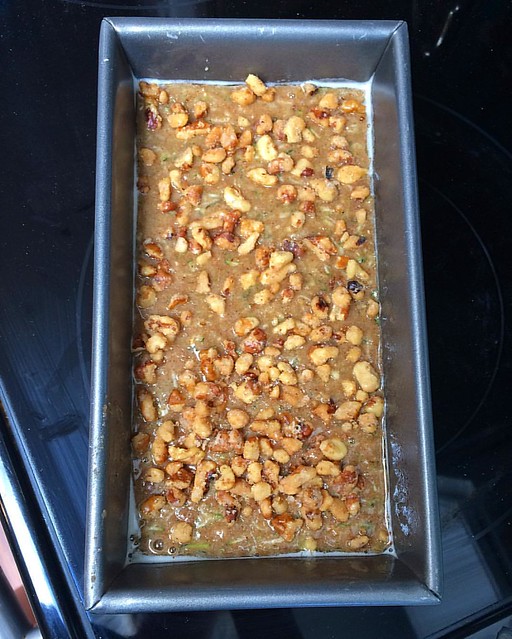Currently going into the oven: zucchini bread with crushed glazed walnut topping. Mmmmmm. 💚