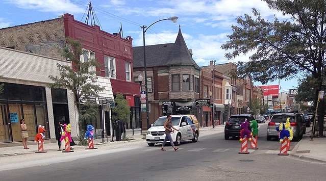 04 Susan Krueger-Barber Pinatas in place in crosswalk at Drake and Milwaukee as traffic calmers 080716